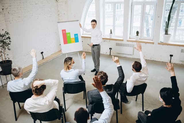A communication instructor guiding an attentive group